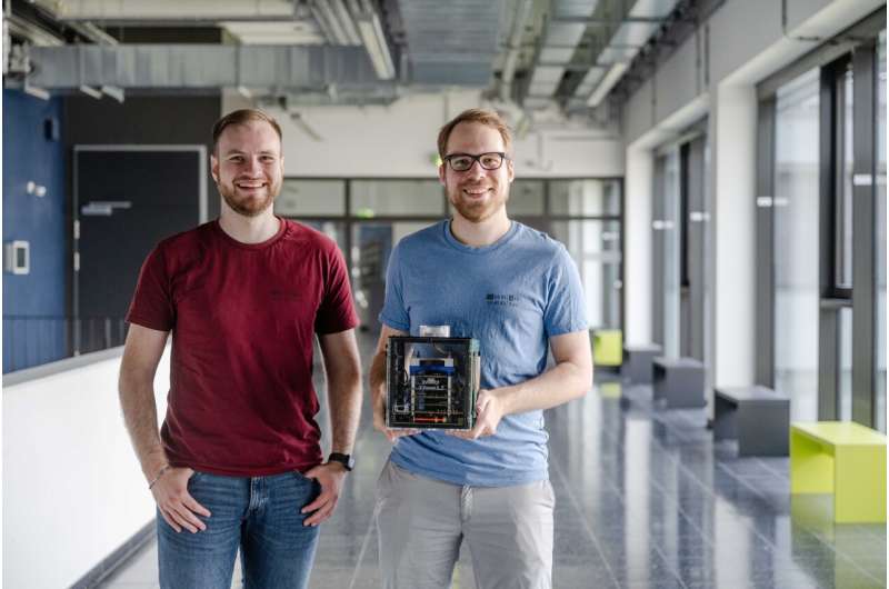 Moritz Schloegel (left) and Johannes Willbold analyzed the safety of satellites. Credit: RUB, Marquard Satellite security lags decades behind the state of the art